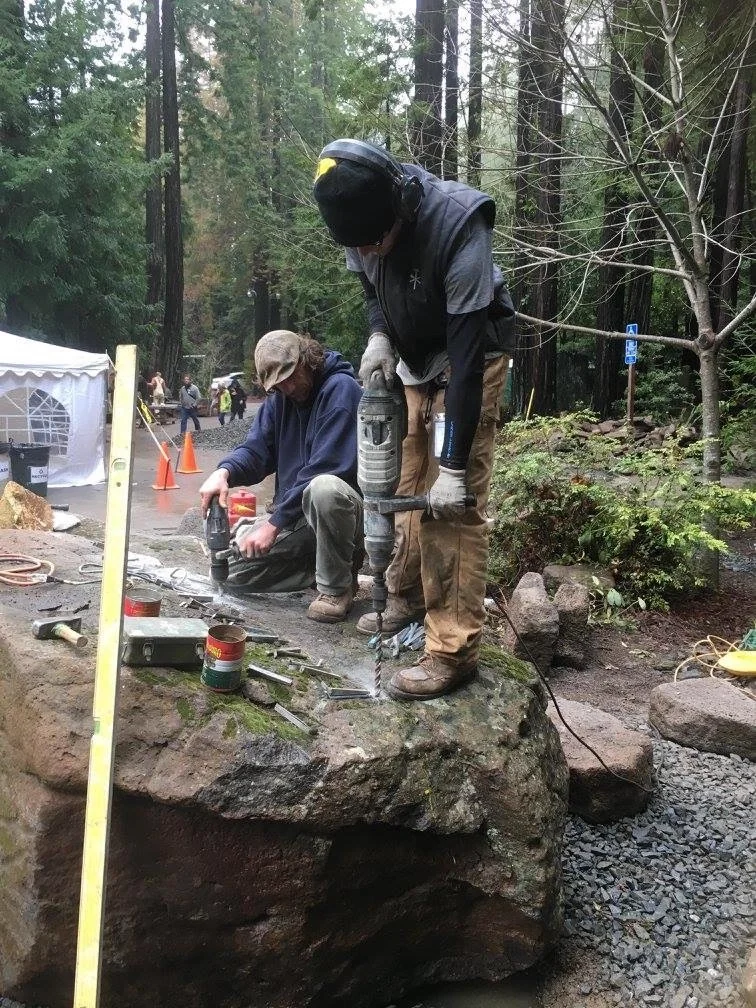GO Landscaping crew building a stone water feature