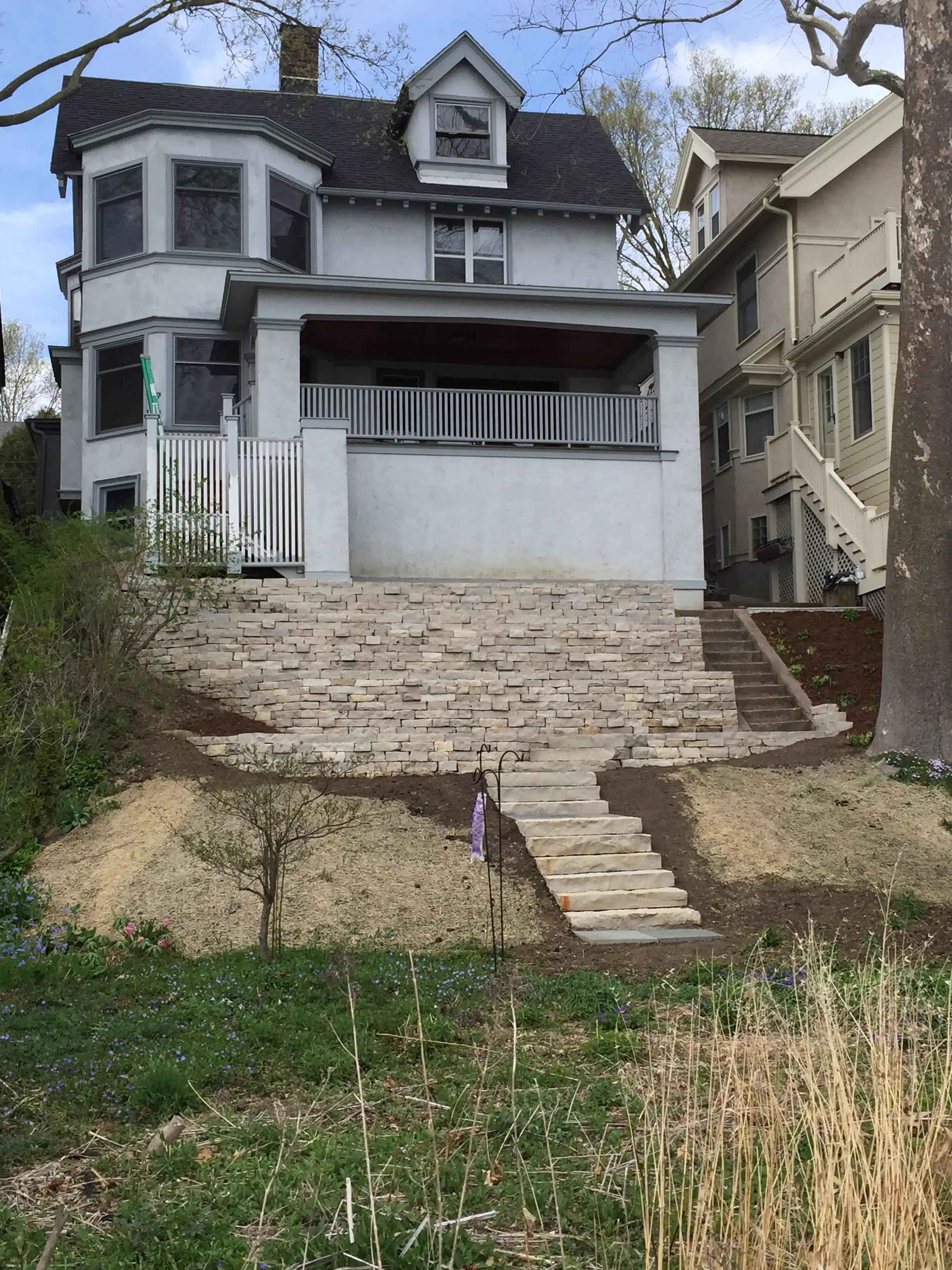 Drystone retaining wall in front of a Victorian home