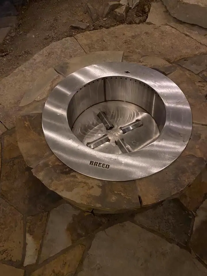 Detail of a custom stone fire pit burner