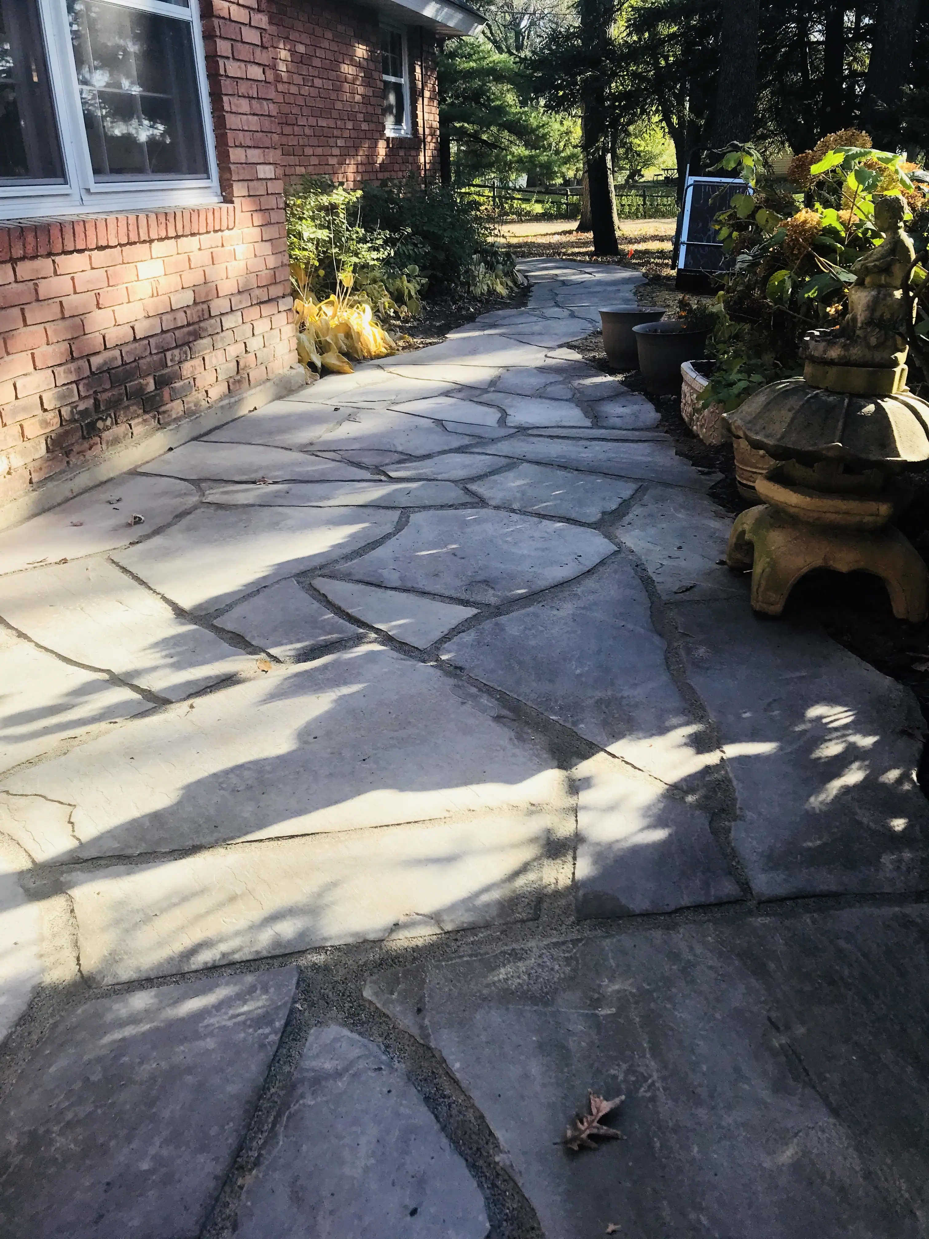 Large flagstone patio installation by GO Landscaping