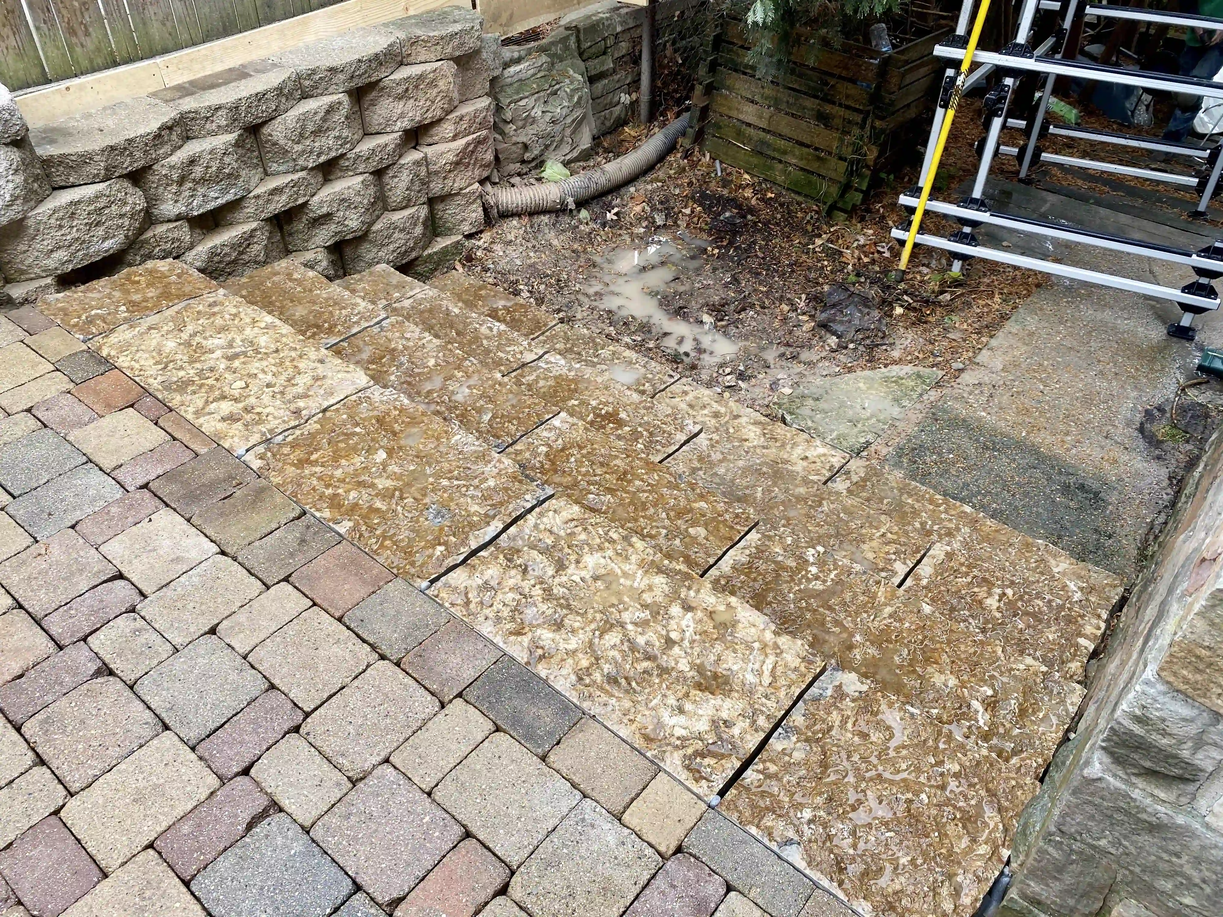 Block retaining wall above flagstone flooring detail